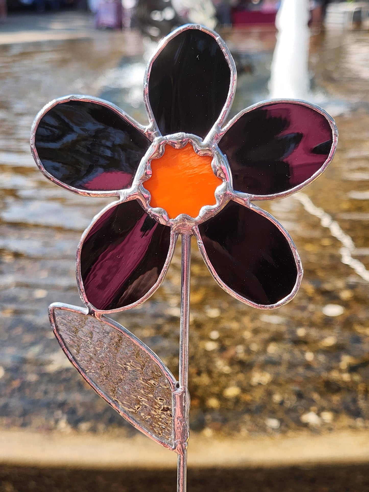 Black Waterglass Stained Glass Daisy Plant Stake with Orange Scallop Center