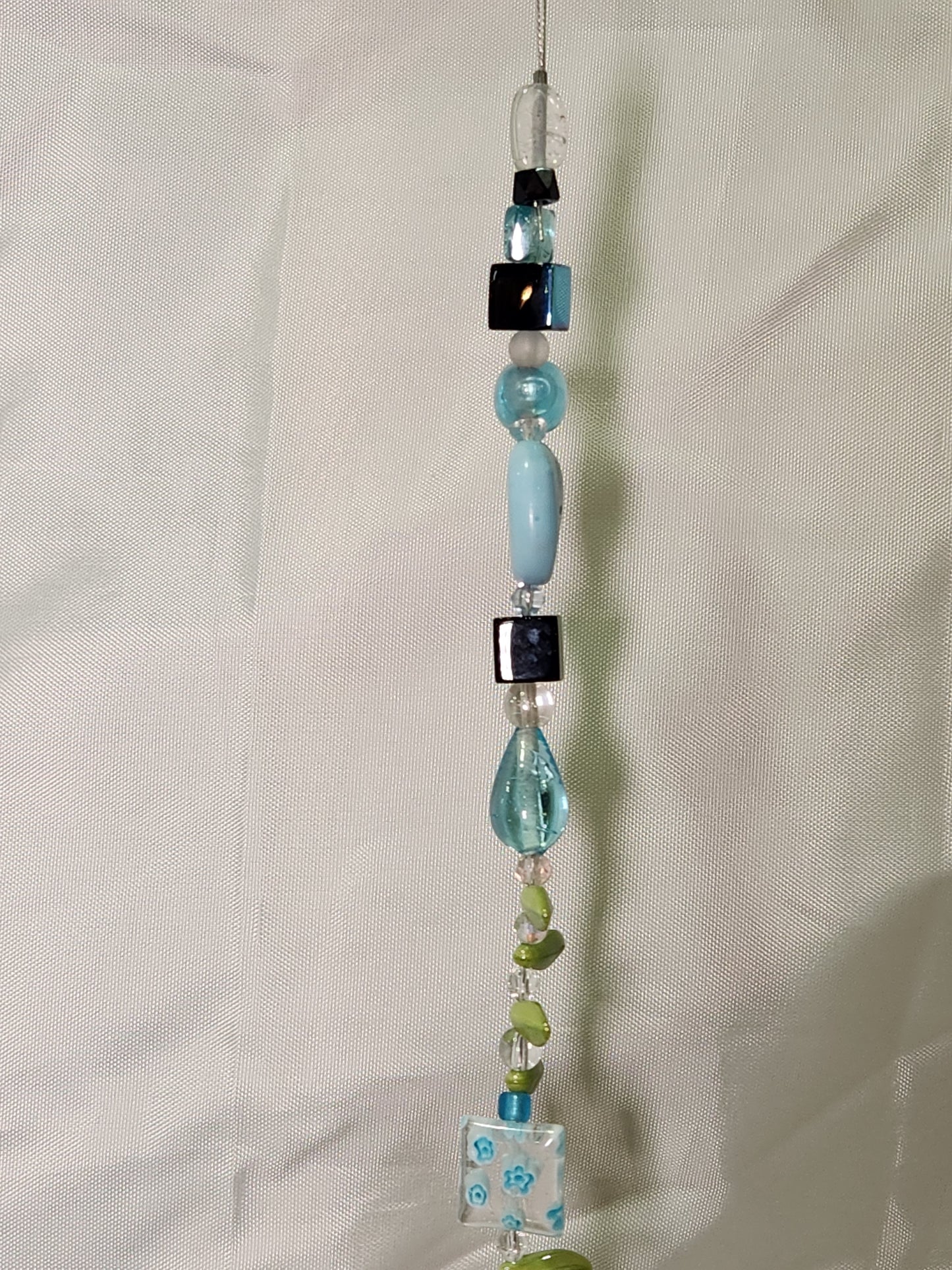 Light Blue, Black and Green Petals Suncatcher