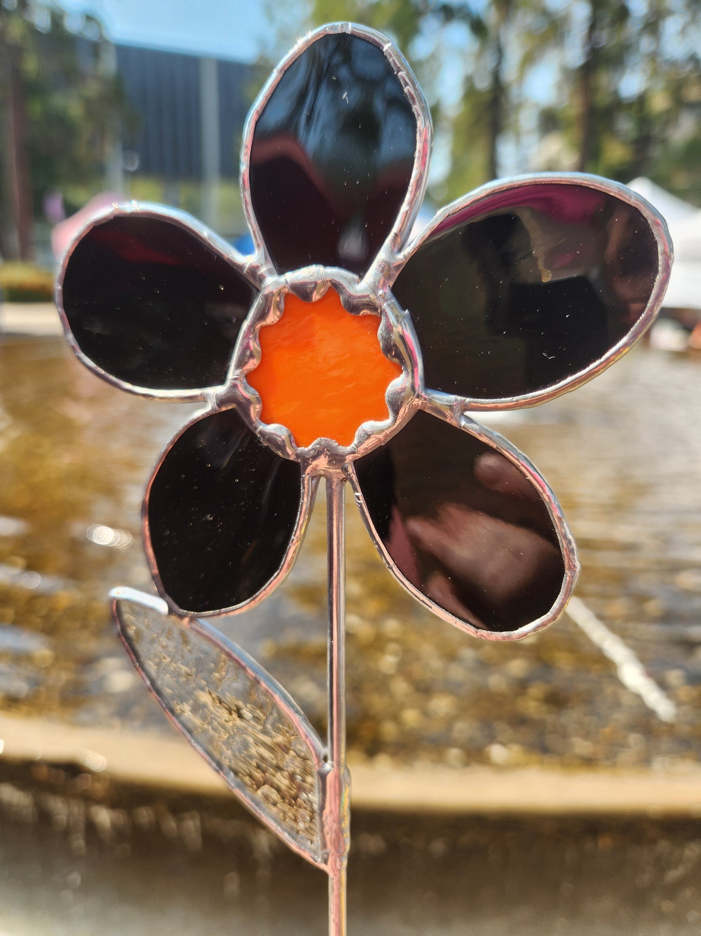Black Waterglass Stained Glass Daisy Plant Stake with Orange Scallop Center