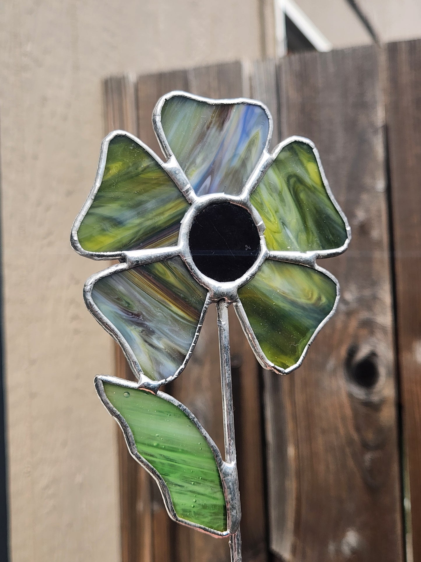 Opaque Green/Blue Streaky Stained Glass Wavy Flower Plant Stake with Dark Purple Glass Center